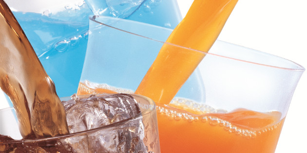 Refreshing water in transparent glass with reflection against bl